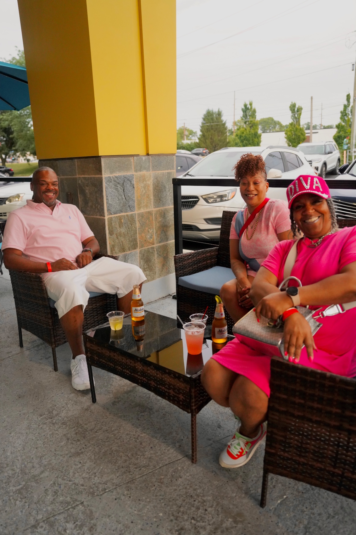 Friends relaxing with drinks on the Cross patio