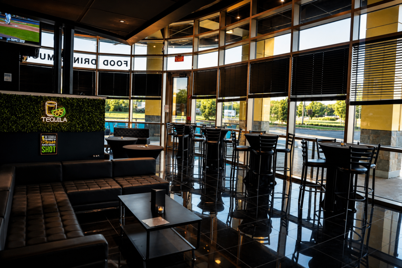 Daytime lounge seating beside the window wall at Cross