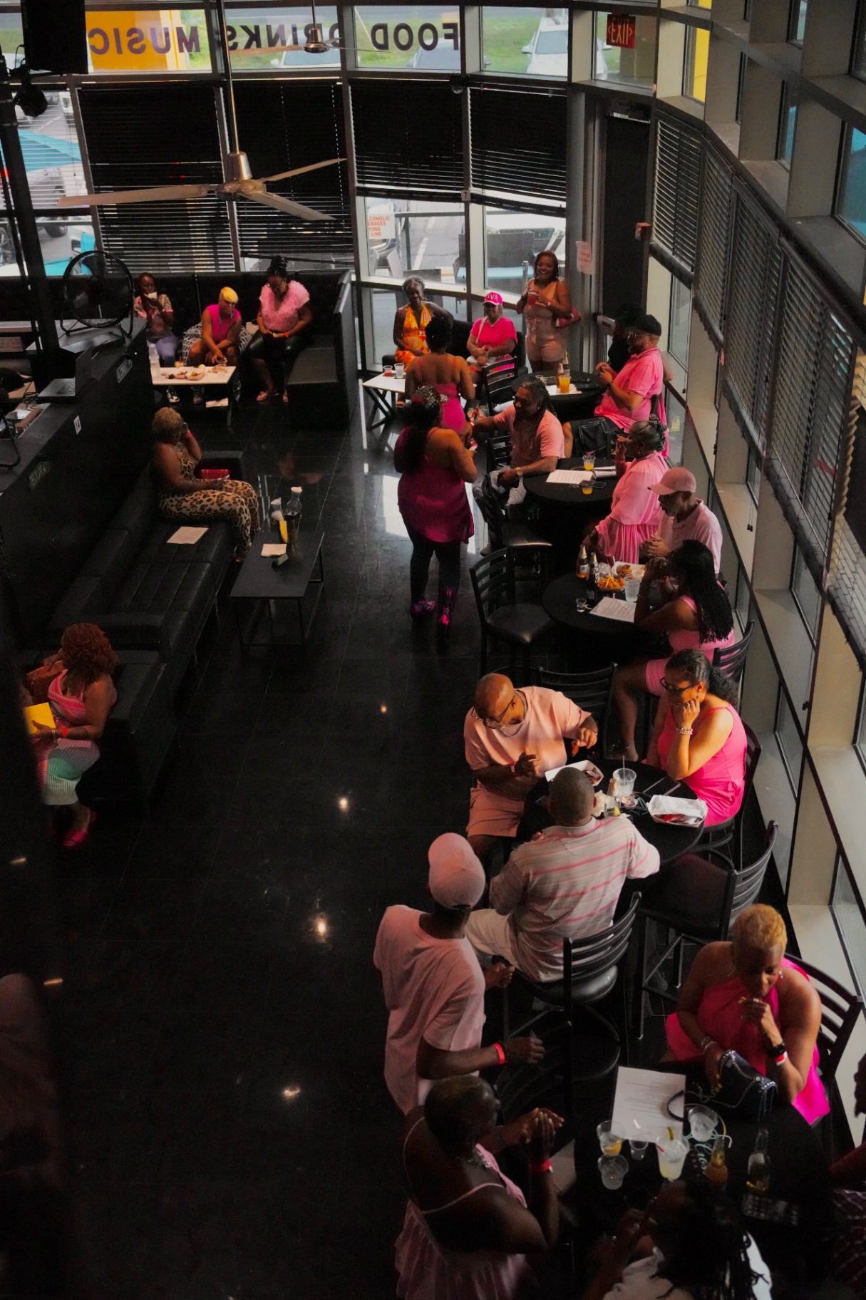 Guests dining and socializing across the main floor at Cross Ultra Lounge